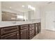 Bathroom features a double sink vanity, large mirror and separate shower at 15 Manas Ct, Covington, GA 30016