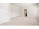 Bright bedroom features neutral carpet and access to an ensuite bathroom at 15 Manas Ct, Covington, GA 30016