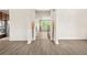 Inviting entryway featuring modern flooring, neutral walls, and decorative wainscoting at 15 Manas Ct, Covington, GA 30016