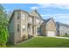 Beautiful two-story home with brick and siding, lush lawn, and a two-car garage at 15 Manas Ct, Covington, GA 30016