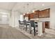Eat-in kitchen with dark cabinets, granite countertops, and pendant lighting at 15 Manas Ct, Covington, GA 30016