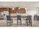 Stylish eat-in kitchen with dark cabinets, stainless steel appliances, and bar seating at 15 Manas Ct, Covington, GA 30016