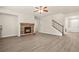 Spacious living room with fireplace and stair access to the second floor at 15 Manas Ct, Covington, GA 30016