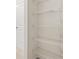 Walk-in closet featuring white shelving at 15 Manas Ct, Covington, GA 30016