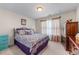 Charming bedroom with metal bed frame and natural light from a window at 2034 Reavis Blf, Conyers, GA 30012