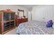 Relaxing bedroom with closet and dresser, plus a patterned purple bedspread at 2034 Reavis Blf, Conyers, GA 30012