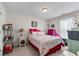 Inviting bedroom with colorful floral bedding and natural light at 2034 Reavis Blf, Conyers, GA 30012