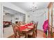Bright dining room with hardwood floors, chandelier, and elegant furnishings at 2034 Reavis Blf, Conyers, GA 30012