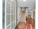 Welcoming foyer with hardwood floors and a staircase leading to the upper level at 2034 Reavis Blf, Conyers, GA 30012