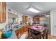 Bright kitchen with stainless steel appliances, wooden cabinetry and eat in table at 2034 Reavis Blf, Conyers, GA 30012