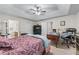 Spacious main bedroom with a tray ceiling, ceiling fan, and carpet flooring at 2034 Reavis Blf, Conyers, GA 30012