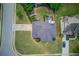 Aerial view of the home showcasing the outdoor fire pit and deck in the backyard at 2112 Ivey Chase Dr, Dacula, GA 30019