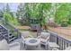 Outdoor deck area featuring a fire pit with comfortable seating and a view of the backyard at 2112 Ivey Chase Dr, Dacula, GA 30019