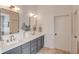 Elegant bathroom with double sinks, framed mirrors, and stylish cabinetry at 2112 Ivey Chase Dr, Dacula, GA 30019