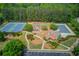 Aerial view of the community amenities: tennis courts, basketball court, playground, and pool at 2112 Ivey Chase Dr, Dacula, GA 30019