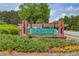 Entrance to the Ivey Chase community in a wooded area with manicured landscaping at 2112 Ivey Chase Dr, Dacula, GA 30019