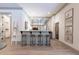 Stylish bar area features marble countertops and seating for four, complete with ladder decor at 101 Morgan Ln, Canton, GA 30115