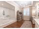 Serene bathroom with a soaking tub, a walk-in shower, and lots of storage at 101 Morgan Ln, Canton, GA 30115