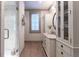 Elegant bathroom with walk-in shower, marble vanity, and storage cabinet for a clean design at 101 Morgan Ln, Canton, GA 30115
