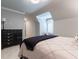 Slanted bedroom with gray walls, black wood dresser, and plush carpet at 101 Morgan Ln, Canton, GA 30115