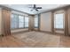 Serene bedroom boasts plush carpeting and natural light from the shuttered windows at 101 Morgan Ln, Canton, GA 30115