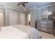 Spacious bedroom features neutral colors, ensuite, and a dresser with ornate mirror at 101 Morgan Ln, Canton, GA 30115