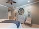 Stylish bedroom with white dresser, two chairs and a large round mirror on the wall at 101 Morgan Ln, Canton, GA 30115