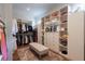 Spacious walk-in closet featuring custom shelving and a central seating area at 101 Morgan Ln, Canton, GA 30115