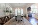Elegant dining room with views to the kitchen, stylish furniture and hardwood floors at 101 Morgan Ln, Canton, GA 30115