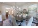 Formal dining room features elegant lighting, modern decor, and ample seating at 101 Morgan Ln, Canton, GA 30115