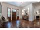 Welcoming foyer with hardwood floors, decorative mirror, and a beautiful wooden front door at 101 Morgan Ln, Canton, GA 30115