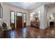 Inviting foyer with hardwood floors, paneled wood front door, and stylish console table at 101 Morgan Ln, Canton, GA 30115