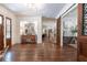 Grand foyer featuring hardwood floors, detailed trim, and beautiful console tables at 101 Morgan Ln, Canton, GA 30115