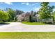 Stunning two-story home with a well-manicured lawn and a circular driveway, perfect for luxurious living at 101 Morgan Ln, Canton, GA 30115
