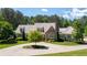 Beautiful home with brick and siding exterior, meticulous landscaping, and circular driveway at 101 Morgan Ln, Canton, GA 30115