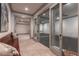 Hallway leading to basement gym, featuring wood look flooring and natural light at 101 Morgan Ln, Canton, GA 30115