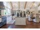 Spacious kitchen with wooden floors, an island, modern appliances, and ample natural light at 101 Morgan Ln, Canton, GA 30115