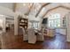 Open-concept kitchen and dining with rustic cabinets, professional range, open shelving and vaulted ceiling at 101 Morgan Ln, Canton, GA 30115