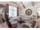 Comfortable living room featuring a brick fireplace, and neutral furniture at 101 Morgan Ln, Canton, GA 30115
