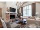 Beautiful living room with a brick fireplace, beamed ceiling, and stylish furnishings at 101 Morgan Ln, Canton, GA 30115