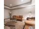 Inviting living room featuring recessed lights, tan sofas with decorative pillows, an area rug and other decorative furniture at 101 Morgan Ln, Canton, GA 30115