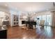 Cozy living room with a fireplace, piano, and access to the outdoor living space at 101 Morgan Ln, Canton, GA 30115