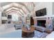 Cozy living room with a brick fireplace, high ceilings, and open kitchen views at 101 Morgan Ln, Canton, GA 30115