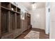 Well-organized mud room with custom wooden lockers, storage, and farmhouse-style decor at 101 Morgan Ln, Canton, GA 30115