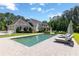 Relaxing backyard with a rectangular pool, patio loungers, and mature landscaping at 101 Morgan Ln, Canton, GA 30115