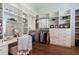 Organized walk-in closet with custom shelving, drawers, and a vanity area at 101 Morgan Ln, Canton, GA 30115