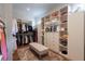 Spacious walk-in closet offers ample storage, shelving, and a comfortable seating area at 101 Morgan Ln, Canton, GA 30115