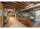 Spacious unfinished basement features exposed beams, concrete floor, laundry area, and seating area at 1901 Trophy Dr, Marietta, GA 30062
