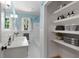Bright bathroom with classic fixtures, tile flooring, ample storage shelving at 1901 Trophy Dr, Marietta, GA 30062