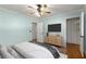 Light-filled bedroom features hardwood floors, soft blue walls and ample closet space at 1901 Trophy Dr, Marietta, GA 30062